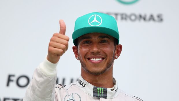 Lewis Hamilton is smiling with a thumbs up gesture during an event, 4K Desktop Wallpaper