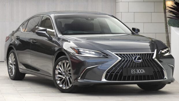 A sleek Lexus Es 300h hybrid car parked on a tiled surface near a building, HD Desktop Wallpaper