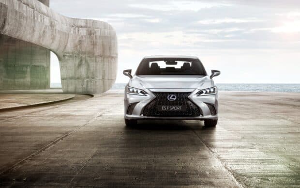 A silver Lexus Es F Sport is parked in front of a concrete structure near the ocean, Lexus Es Wallpapers, 2K Desktop Wallpaper