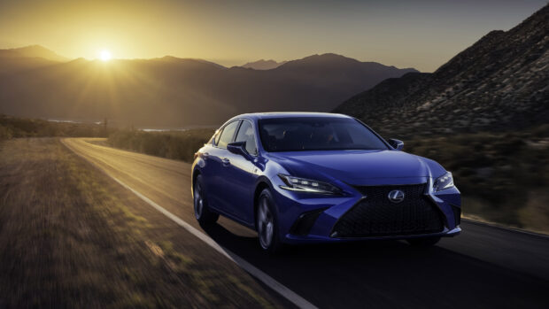 A blue Lexus Es drives on a scenic mountain road during sunset, 4K Desktop Wallpaper