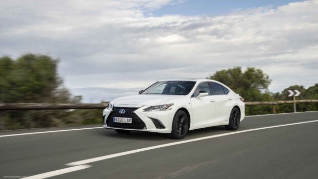 A white Lexus Es is driving smoothly on a countryside road under a partly cloudy sky, 4K Desktop Wallpaper