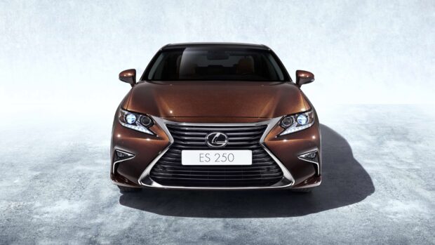 A brown Lexus Es with illuminated headlights is shown from the front, 4K Desktop Wallpaper
