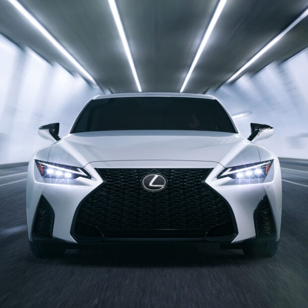 A white Lexus Es displayed with headlights on in a tunnel setting, HD Desktop Wallpaper