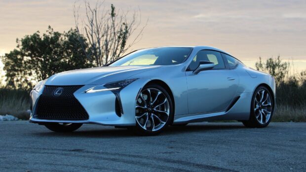 A silver Lexus LC is parked on a road with trees in the background during sunset, HD Desktop Wallpaper