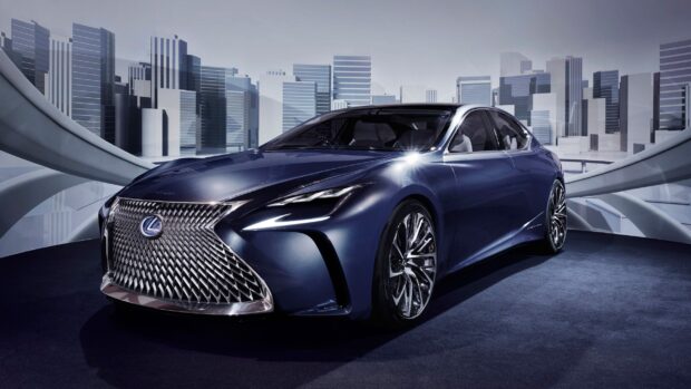 A sleek Lexus LC is showcased with a modern cityscape in the background, 2K Desktop Wallpaper