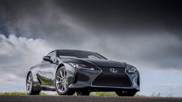 A sleek Lexus LC luxury sports car is parked on a road under a cloudy sky, 4K Desktop Wallpaper