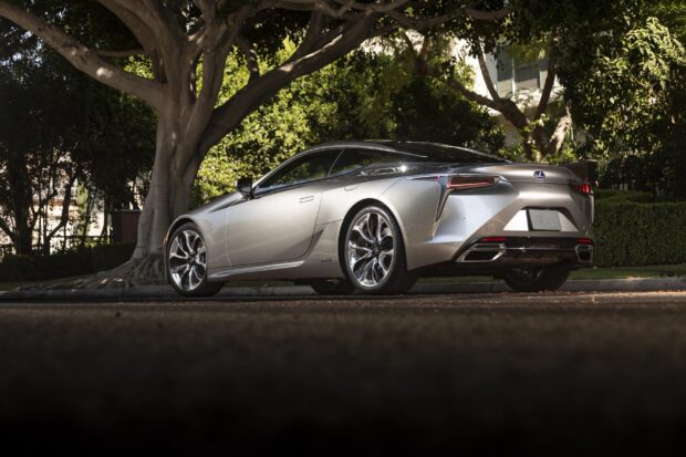 A silver Lexus LC is parked under a tree on a quiet street, 2K Desktop Wallpaper