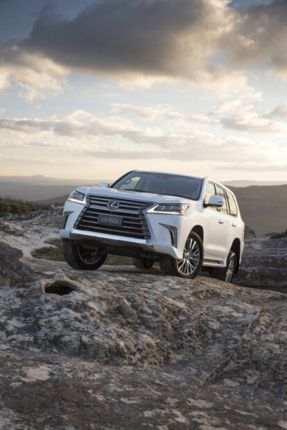 A Lexus LX 450d driving over rocky terrain under a cloudy sky, HD Mobile Wallpaper