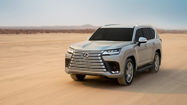 A silver Lexus LX is driving fast on a sandy desert road, HD Desktop Wallpaper