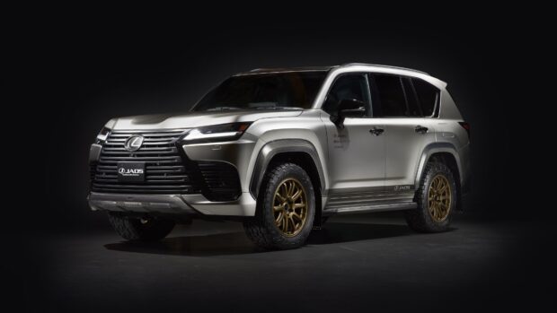 A sleek silver Lexus LX is showcased under dramatic lighting, highlighting its bold design and rugged features, 4K Desktop Wallpaper