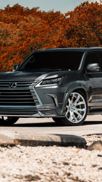 A Lexus LX luxury SUV is parked near autumn trees with orange leaves, HD Phone Wallpaper