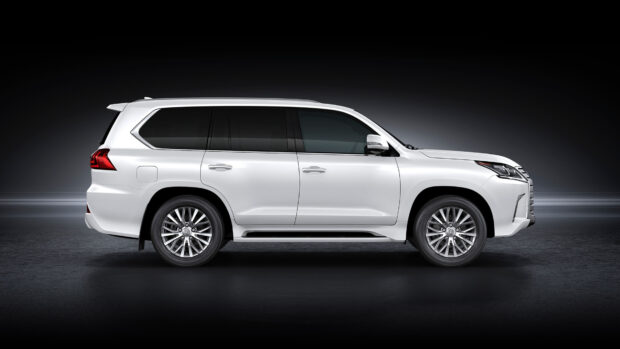 The Lexus LX is a sleek white luxury SUV shown in profile on a dark background, 4K Desktop Wallpaper