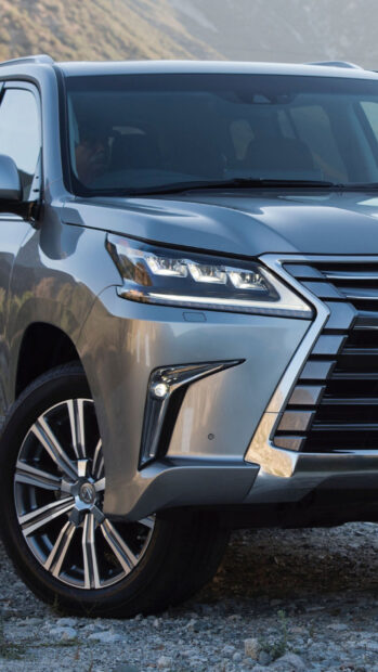 A silver Lexus Lx luxury SUV captured from the front side in a rugged outdoor setting, HD Mobile Wallpaper