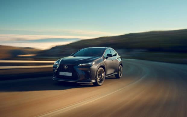 A Lexus NX drives swiftly on a winding mountain road during sunset, HD Desktop Wallpaper