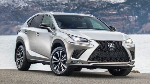 A silver Lexus NX is parked near a body of water with mountains in the background, 4K Desktop Wallpaper