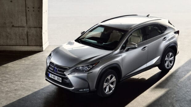 A silver Lexus NX is parked in a modern concrete setting with sunlight casting shadows, 4K Desktop Wallpaper