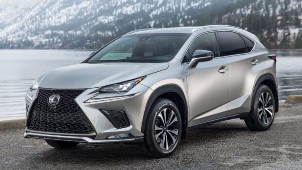 A silver Lexus Nx stands by a lake with snowy mountains in the background, 4K Desktop Wallpaper
