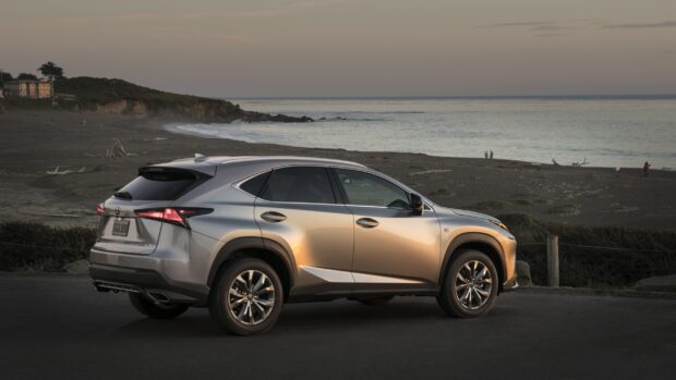A silver Lexus Nx is parked near the beach with the sunset reflecting on its side, 2K Desktop Wallpaper