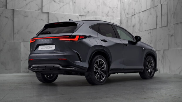 A sleek Lexus Nx rear view in a modern setting featuring illuminated tail lights, 4K Desktop Wallpaper