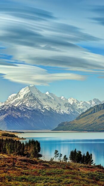 A clear view of Liechtenstein mountains with a calm lake and blue sky, HD Mobile Wallpaper