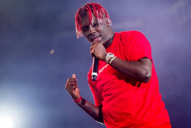Lil Yachty wears a red outfit while singing during a concert, HD Desktop Wallpaper