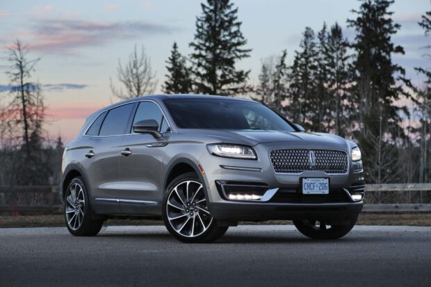 A silver Lincoln Nautilus parked with headlights on during sunset, HD Desktop Wallpaper