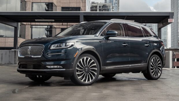 A black Lincoln Nautilus is parked in an urban rooftop parking lot, HD Desktop Wallpaper