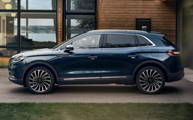 The Lincoln Nautilus shows a sleek design parked by a wooden house, HD Desktop Wallpaper