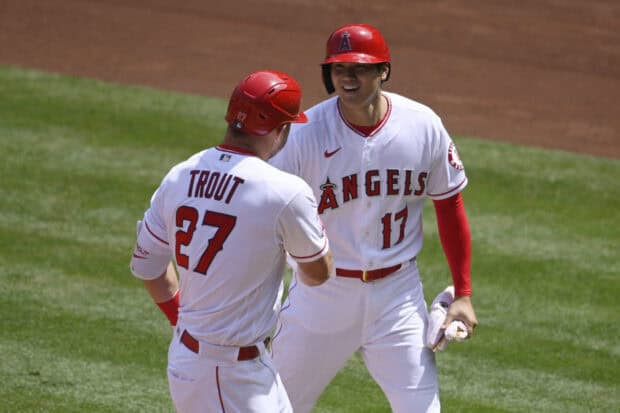 Two Los Angeles Angels players smiling and interacting on the baseball field, 2K Desktop Wallpaper