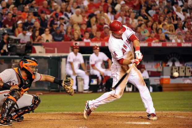 A Los Angeles Angels player swings the bat during a game at the stadium, HD Desktop Wallpaper