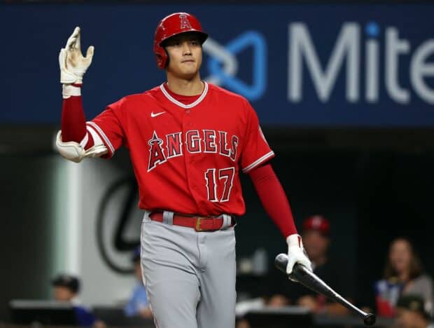 A Los Angeles Angels player wearing red jersey prepares to swing the bat during the game, HD Desktop Wallpaper