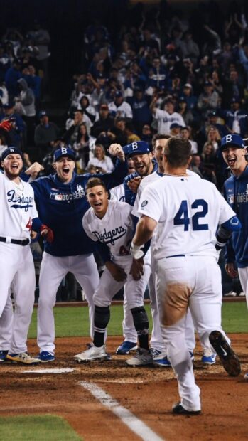 Los Angeles Dodgers players celebrate a key moment during the game, HD Phone Wallpaper