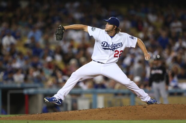 A Los Angeles Dodgers player is pitching the ball during a game at the stadium, HD Desktop Wallpaper