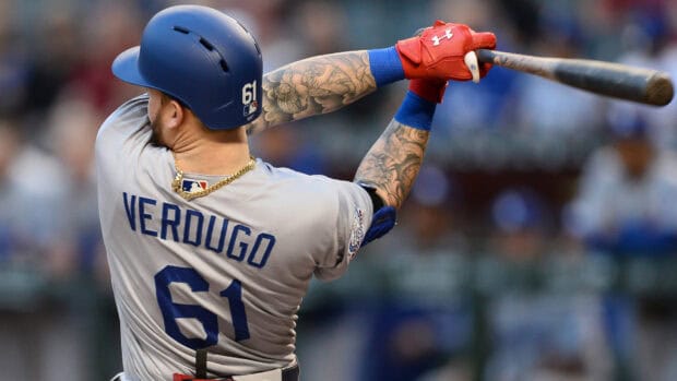 A Los Angeles Dodgers player swings the bat during a game in front of the crowd, HD Desktop Wallpaper