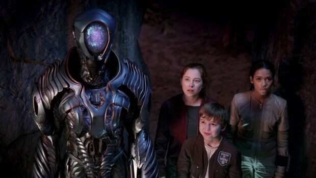 The Lost In Space TV series characters stand next to a robot inside a cave, Lost In Space Tv Series Wallpapers, 4K Desktop Wallpaper