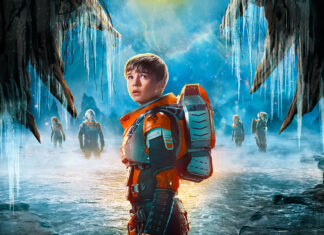 A group of Lost In Space tv series characters explore a frozen cave in space with icy stalactites and fog, 4K Desktop Wallpaper