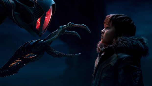 A tense moment between a boy and a robotic creature in Lost In Space Tv Series, 2K Desktop Wallpaper