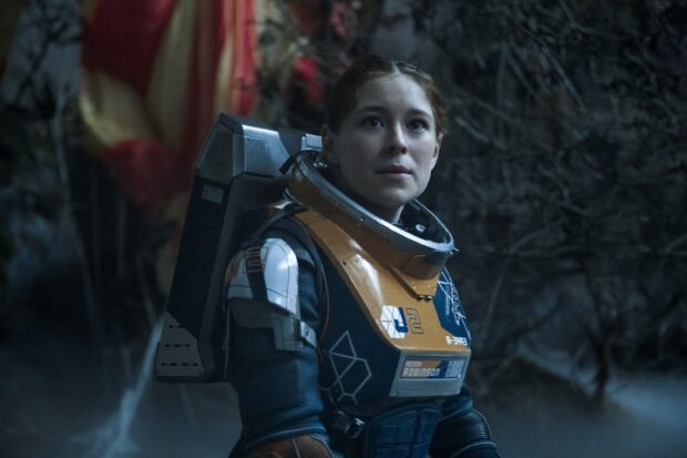 A woman in a space suit explores a mysterious alien environment in Lost In Space Tv Series, 2K Desktop Wallpaper