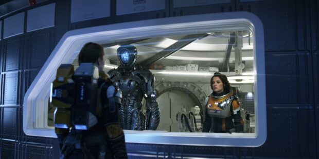 A robot and crew member are seen inside a spaceship from Lost In Space tv series, 2K Desktop Wallpaper
