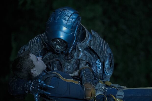 A mysterious alien in armor is holding a boy from the Lost In Space tv series, 2K Desktop Wallpaper