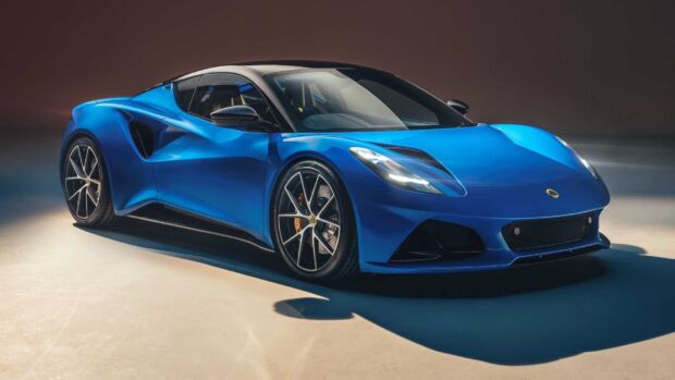 A sleek blue Lotus Emira sports car is displayed on a studio floor, HD Desktop Wallpaper