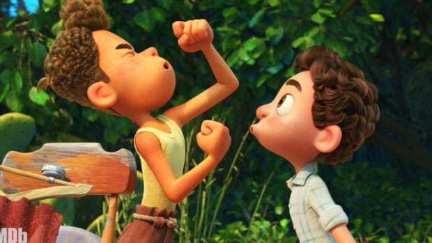 Luca wallpapers show two boys with expressive faces in a green garden, HD Desktop Wallpaper