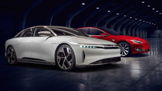A white Lucid Motors car and a red Tesla vehicle are parked together in a modern garage, HD Desktop Wallpaper