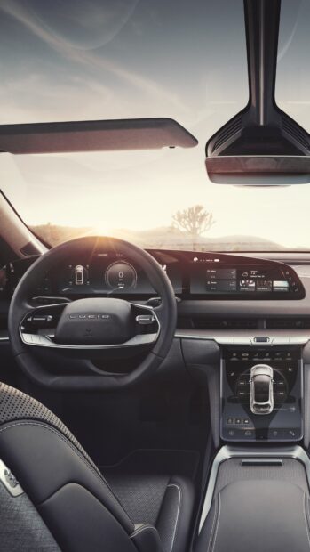 The Lucid Motors dashboard and steering wheel display futuristic controls, 4K Mobile Wallpaper