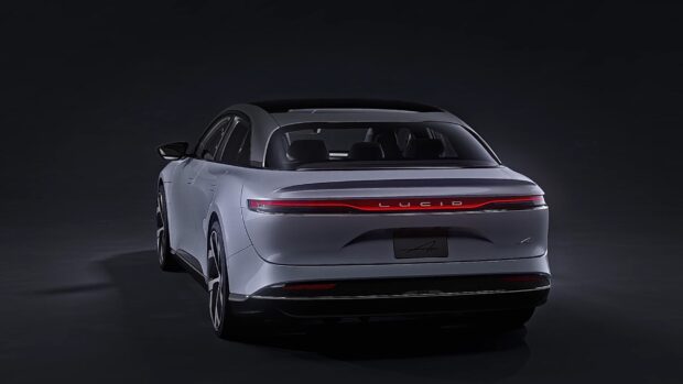 A sleek Lucid Motors car is shown from the rear with glowing red taillights, HD Desktop Wallpaper
