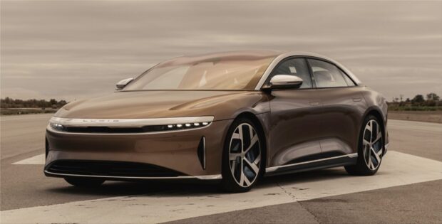 A sleek brown Lucid Motors car parked on a runway under an overcast sky, 2K Desktop Wallpaper