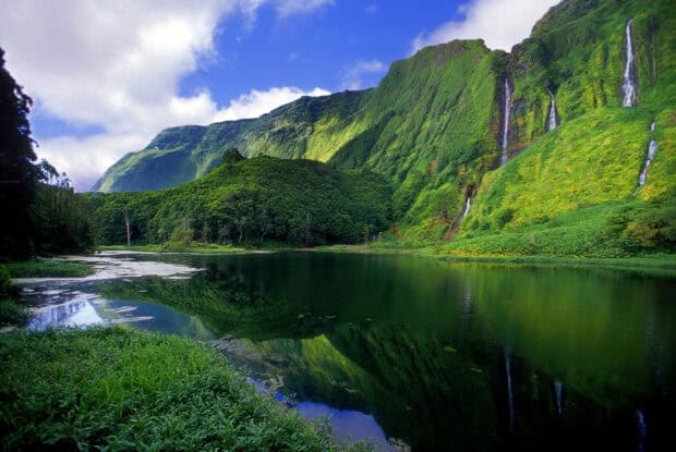 The Azores features lush green mountains and a calm lake under a bright blue sky, HD Desktop Wallpaper