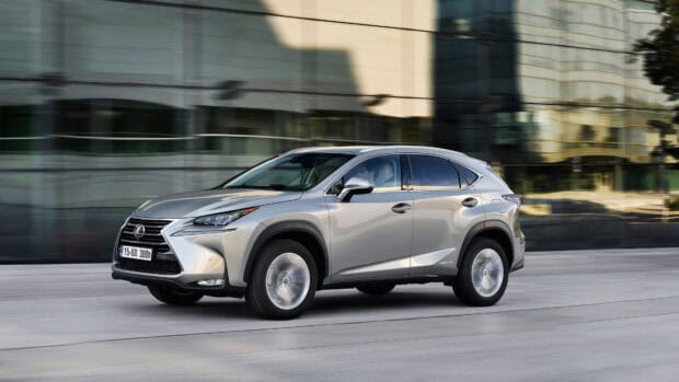 A silver Lexus Nx drives quickly past modern glass buildings, 4K Desktop Wallpaper