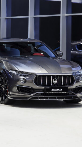 A gray Maserati Levante parked indoors with clear front details visible, 4K Phone Wallpaper
