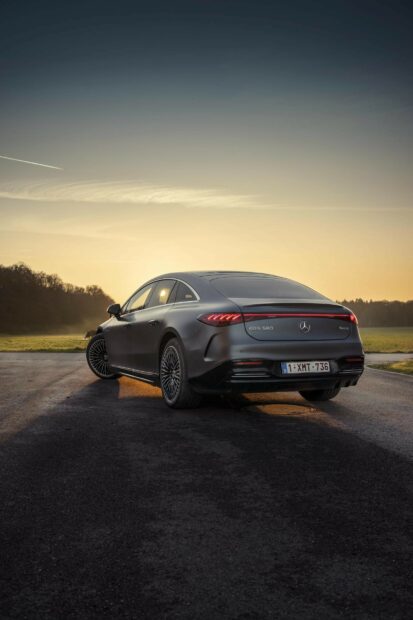 A sleek Mercedes Benz Eqs car is parked on a road with a sunset in the background, HD Mobile Wallpaper